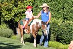 Eliana riding a pony