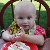 Olivia getting ready to eat some cake.