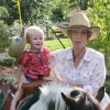 Eliana riding a pony