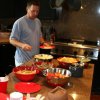 BBQ sandwiches, chips, beans, fruit salad, salsa, guac, etc