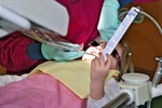 Olivia getting her teeth cleaned.